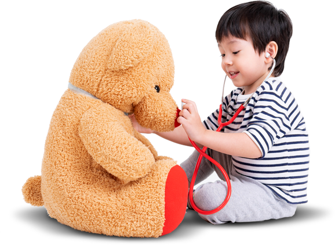child playing doctor role with his teddy bear